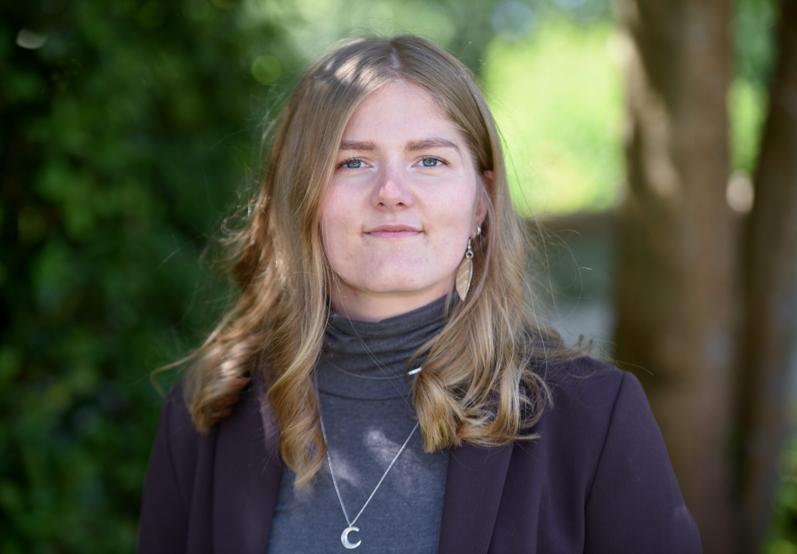 Photograph of Alice Soulsby in front of trees